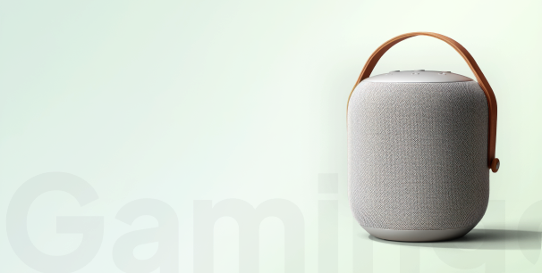 Textured gray container with a brown handle on a light background